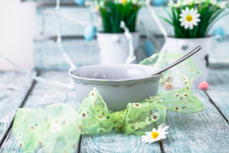 Easter table place setting. Easter table in a rustic vintage style.の写真素材