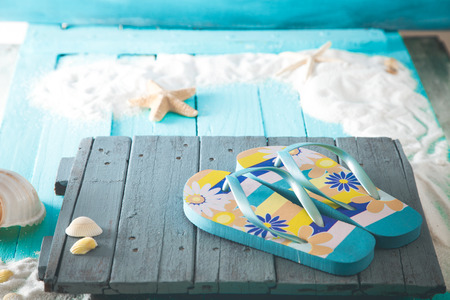 Summer background. Wooden background with white sand and seashells.Shells, starfish and sand. Holiday backgroundの写真素材