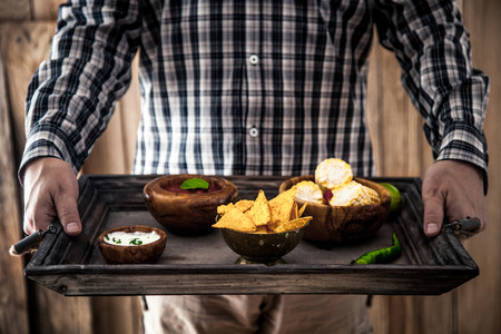 Man with snacks and dips. Tortilla mexican foodの写真素材