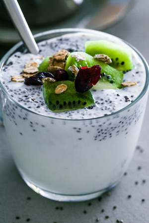 Healthy breakfast variety. Cereals with fruit. Yogurt with seedsの写真素材