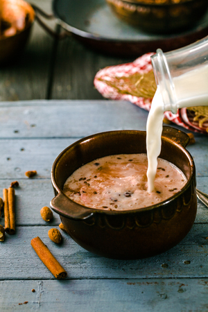 Healthy breakfast variety. Granola  with cocoa and milk. Almond milk with cerealsの写真素材