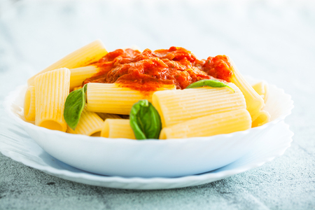 Pasta with Tomato Sauce and Basil on a Fork. Italian food. Mediterranean cuisineの写真素材