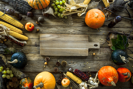 Thanksgiving dinner. Autumn fruit with plate and cutlery. Thanksgiving autumn backgroundの写真素材