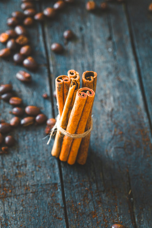 Coffee beans. Cinnamon sticks on wood.  Vintage coffeeの写真素材