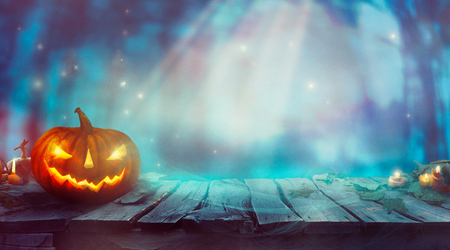 Halloween  with Pumpkin and Dark Forest. Scary Halloween Design on tableの写真素材
