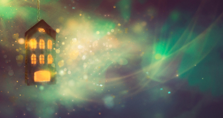Christmas House background. Backdrop with Bokeh Lights. Garland Background wih Blurred Lightsの写真素材