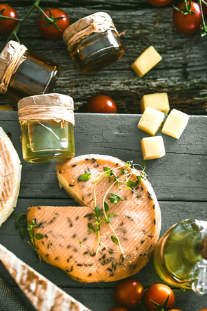 Cheese and Salami. Variety od cold cuts. Cheese on wood. Types of cheese and sausagesの写真素材