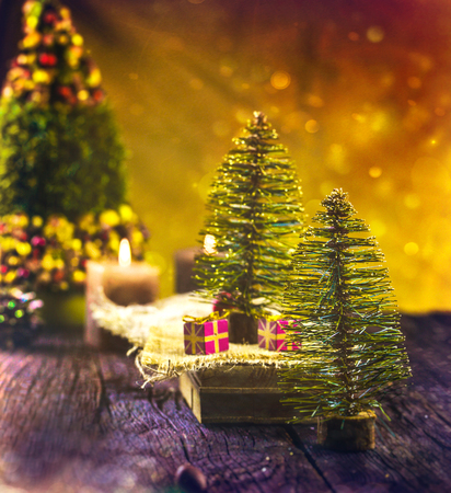 Christmas rustic decoration. Christmas tree, candles and presentsの写真素材