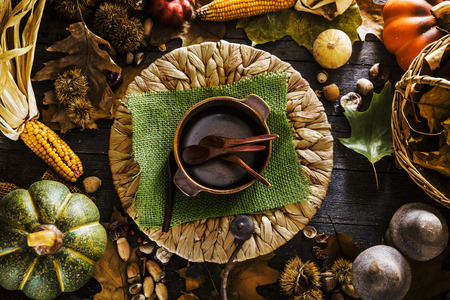 Thanksgiving dinner. Autumn fruit with plate and cutlery. Thanksgiving autumn backgroundの写真素材