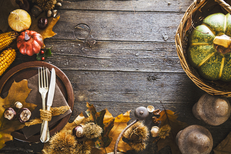 Thanksgiving dinner. Autumn fruit with plate and cutlery. Thanksgiving autumn backgroundの写真素材