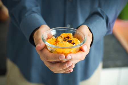 Healthy breakfast variety. Granola with fruit and seeds. Man with breakfastの写真素材