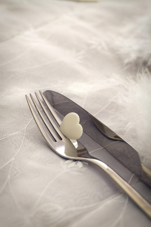 Fork and knife with  heart. Valentine's day   table settingの写真素材