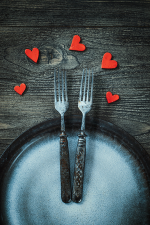 Restaurant menu. Valentines day dinner with table setting in rustic wood style with cutleryの写真素材