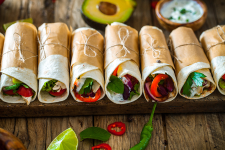 Tortilla wraps with vegetables. Mexican tortillas. Tacos with nachos and vegetablesの写真素材