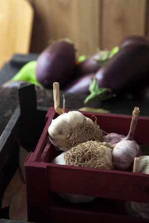 Vegetables on wood. Organic garlic. Organic vegetables in rustic setting. Fresh food. Healthy veggiesの写真素材