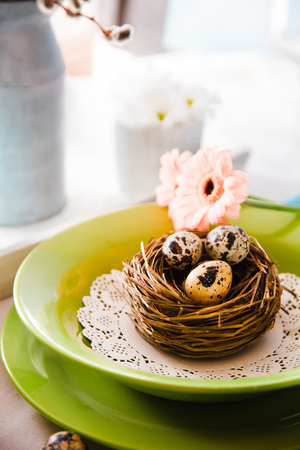 Easter table setting. Fresh eggs on plate. Spring table.の写真素材