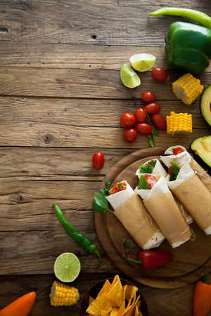 Party food. Tortilla wraps with vegetables. Mexican tortillas. Tacos with nachos and vegetablesの写真素材
