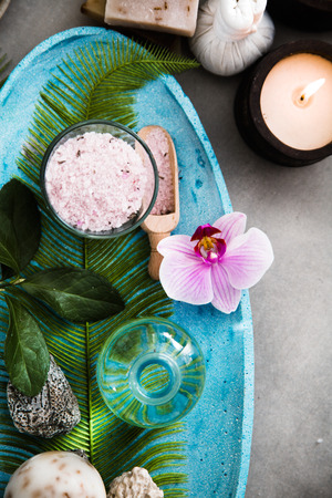 Spa and wellness. Spa products in natural setting with orchid flowerの写真素材