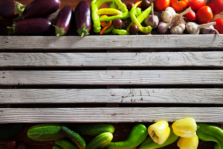 Vegetables on wood. Organic vegetables in rustic setting. Fresh food. Healthy veggiesの写真素材