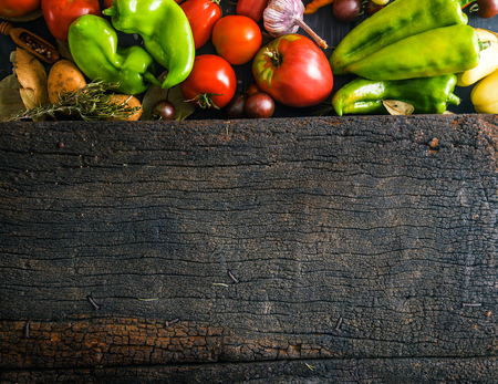 Vegetables on wood. Organic vegetables in rustic setting. Fresh food. Healthy veggiesの写真素材