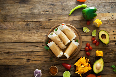 Party food. Tortilla wraps with vegetables. Mexican tortillas. Tacos with nachos and vegetablesの写真素材