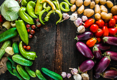 Vegetables on wood. Organic vegetables in rustic setting. Fresh food. Healthy veggies. Overhead shotの写真素材