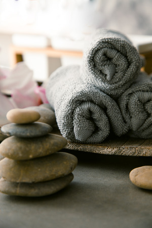 Spa and wellness. Natural massage stones  with magnolia flower. Spa treatmentの写真素材