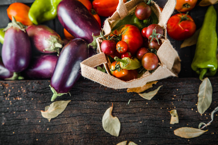 Vegetables on wood. Organic vegetables in rustic setting. Fresh food. Healthy veggiesの写真素材