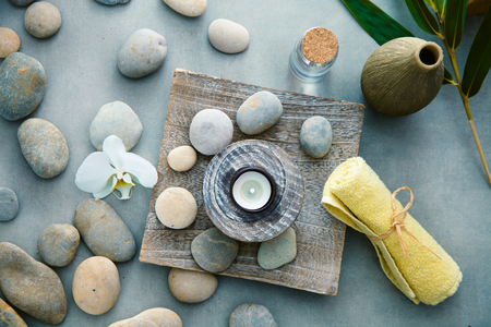 Spa and wellness. Fresh towels  with massage stones. Spa treatment. Overhead flatlayの写真素材