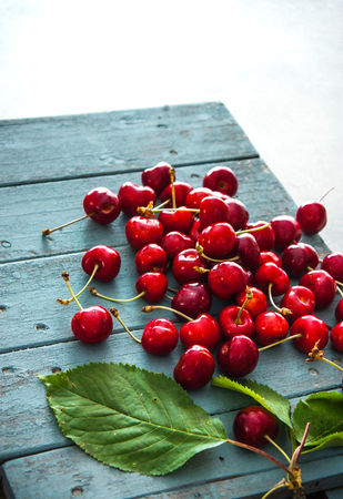 Fresh cherries on wood. Fresh organic fruit. Red cherriesの写真素材