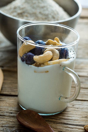 Healthy breakfast variety. Cereals with fruit. Yogurt with seedsの写真素材