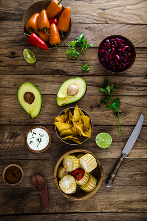 Avocado and tortilla chips  with vegetables.  Tacos with nachos and vegetablesの写真素材