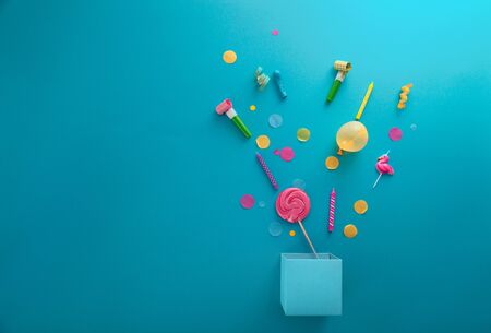 Birthday concept with gift box and confetti. Birthday balloons and candlesの写真素材