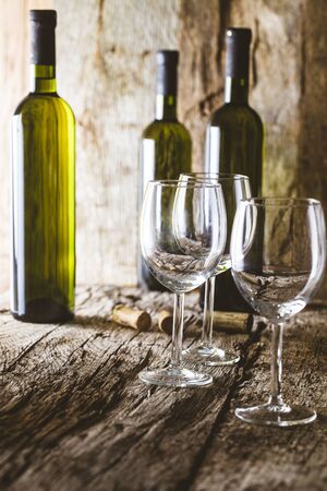 Wine. Glass of white wine in wine cellar. Old white wine on wood.の写真素材