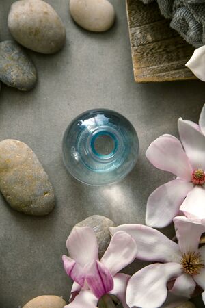 Spa and wellness. Natural massage stones  with magnolia flower .Spa treatmentの写真素材
