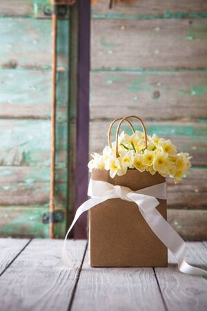 Mother's day. Narcissus flowers with card. Spring flowersの写真素材