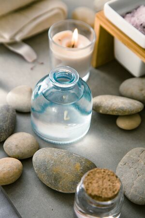 Spa and wellness. Natural massage stones , silkworm cocoon with magnolia flower .Spa treatmentの写真素材
