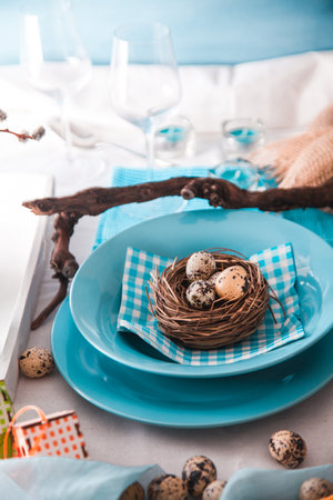 Easter table setting. Fresh eggs on plate. Spring table.