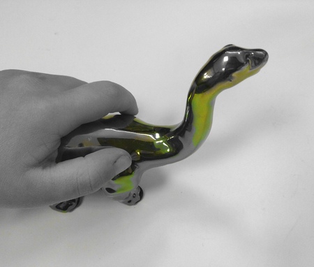 Child holding dinosaurの写真素材