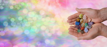 Male Crystal Healer on Rainbow Bokeh Bannerの写真素材