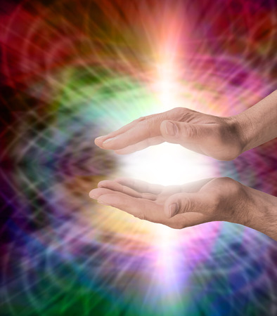 Male with rainbow healing energyの写真素材