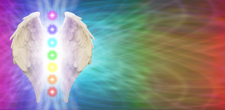 Angel Chakra Wings on rainbow colored banner backgroundの写真素材