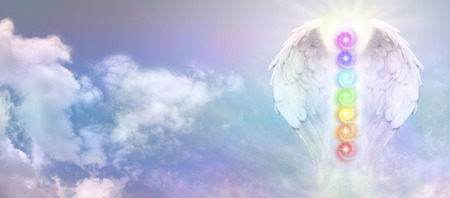 Angel Reiki Wings and Seven Chakras  on blue sky bannerの写真素材
