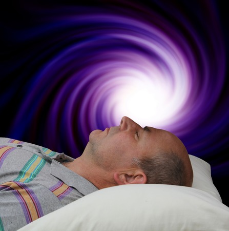 Man lying supine enjoying Vortex Meditationの写真素材