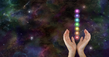 Sending chakra healing energy through spaceの写真素材