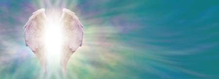 Angel Wings and Healing Light Banner  White Angel wings with bright light beaming outwards from between on an ethereal jade blue green energy formation backgroundの写真素材