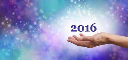 Welcome 2016 Celebration Banner  Female hands outstretched facing upwards with '2016' floating above...