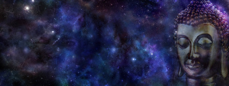 Buddha on deep space background  website header -  Wide deep blue night sky with a cropped head of Buddha on right hand side and plenty of copy space on leftの写真素材