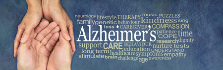 Alzheimer's Word Cloud - female hands gently cupped around male cupped hands beside an ALZHEIMER'S word cloud on a rustic petrol blue  backgroundの写真素材