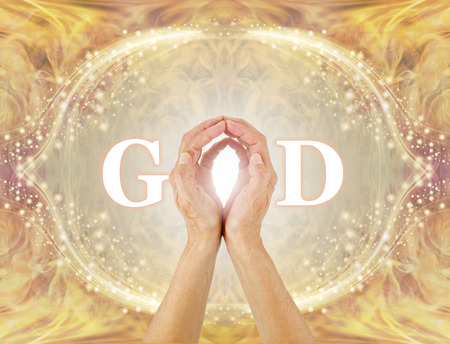 I am connected to All That Is - I am the Light - female hands making the O of GOD on a golden glittering border background with swirling warm gold energy and an oval framework of symmetrical sparklesの写真素材